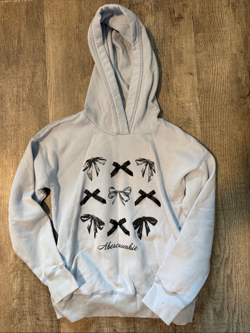 Abercrombie & Fitch Kids Pale Blue Hoodie with Black Bow Graphics size 9/10